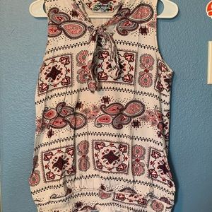 Sleeveless patterned red and white blouse
